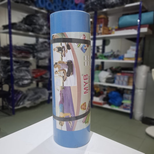 Blue yoga mat with exercise illustrations on a white surface in a store setting